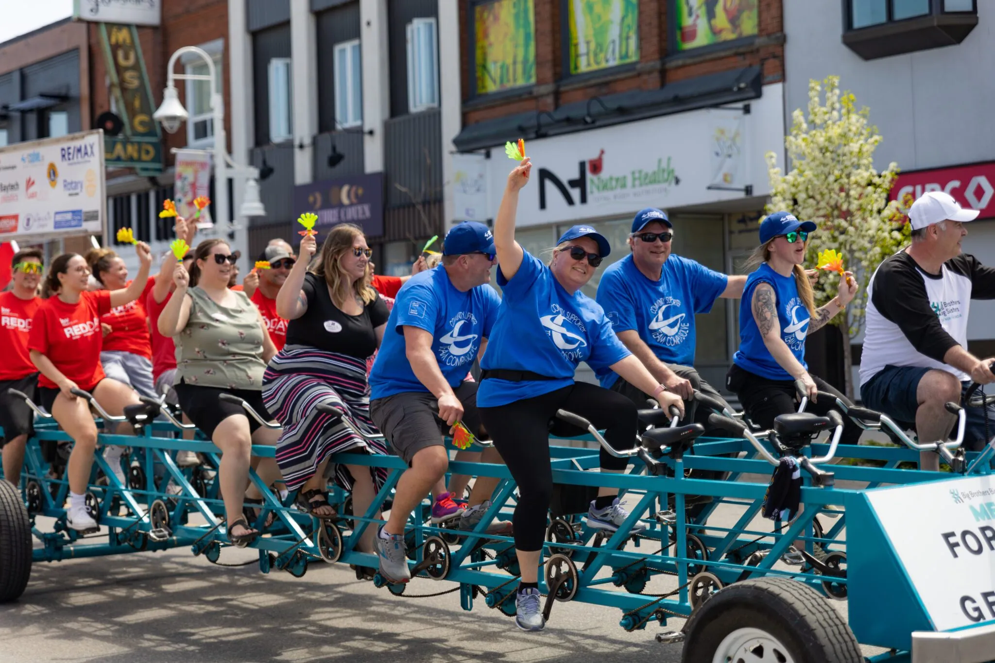 CSOLVE team members riding the Big Brothers Big Sisters MegaBike through downtown Midland