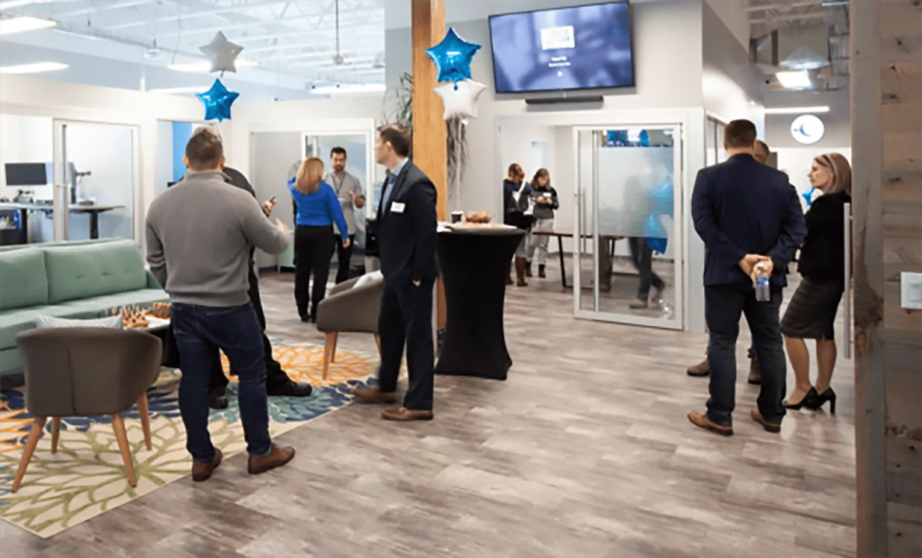 People gathered in the CSOLVE office during an open house event