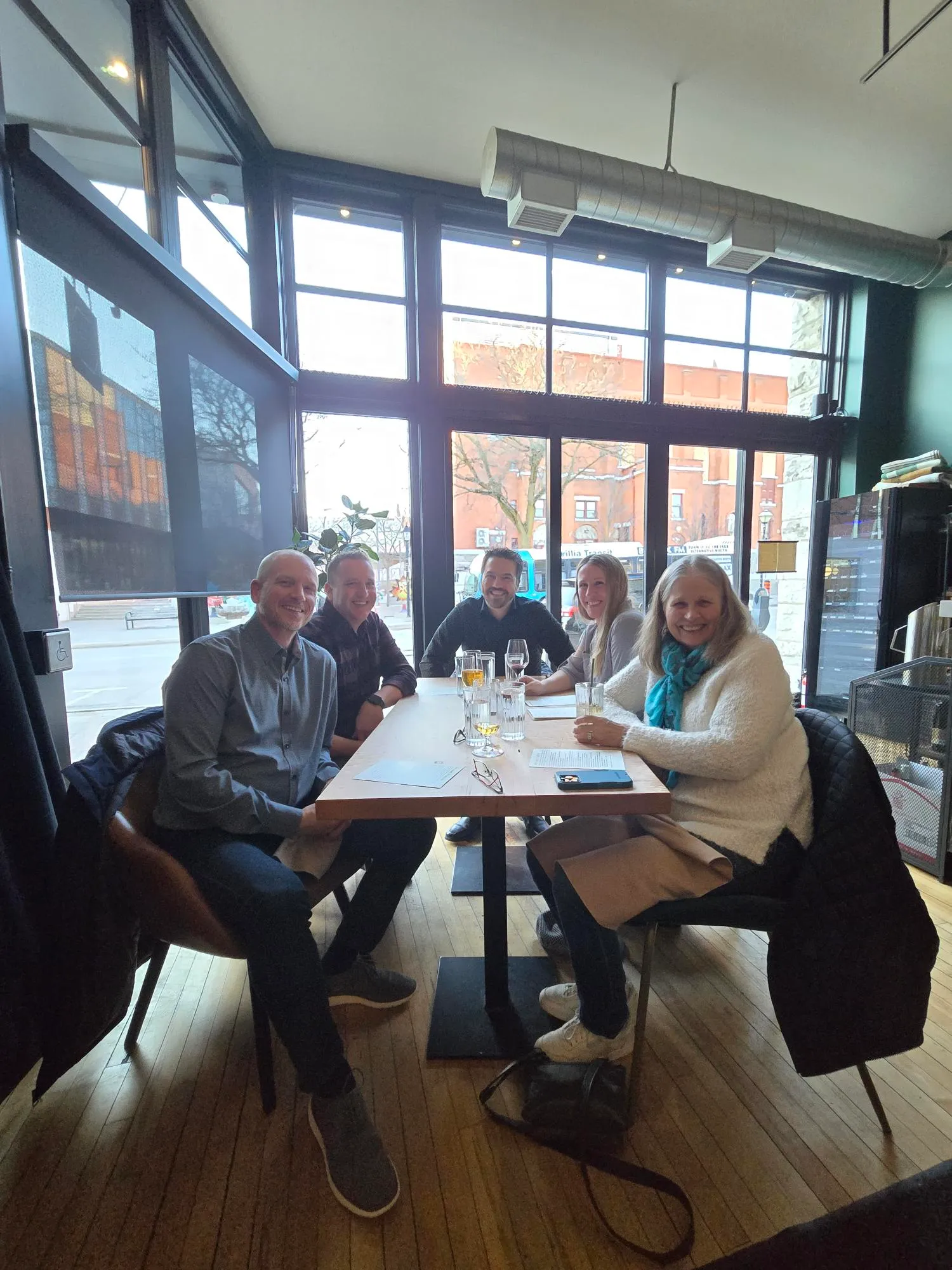 CSOLVE local ownership team gathered at a restaurant table